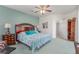Comfortable bedroom with ceiling fan, two side tables, and accent wall at 3821 Tumbleweed Ave, Pahrump, NV 89048