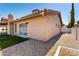 Exterior view of backyard featuring gravel landscaping, manicured yard, and house elevation at 3826 Edmond St, Las Vegas, NV 89103
