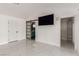 Primary bedroom featuring a barn door and large tv at 3826 Edmond St, Las Vegas, NV 89103