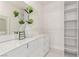 Walk in closet with custom shelving, luxury finishes, and mirrored vanity at 3826 Edmond St, Las Vegas, NV 89103