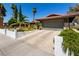 Inviting single-story home showcasing a concrete driveway, two-car garage, and manicured desert landscaping at 3826 Edmond St, Las Vegas, NV 89103
