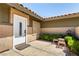 The cozy entrance features a white front door, small plants, and seating area for relaxing at 3826 Edmond St, Las Vegas, NV 89103