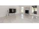 This bright open-concept living space features large windows, marble floors, and stylish decor at 3826 Edmond St, Las Vegas, NV 89103