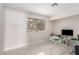 Bright office featuring large window, white marble tile flooring, and modern desk at 3826 Edmond St, Las Vegas, NV 89103