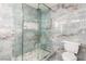 Elegant glass shower with turquoise marbled walls and inset shelf at 3826 Edmond St, Las Vegas, NV 89103
