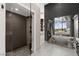 This primary bath includes a modern shower, a soaking tub, and sleek finishes at 387 Solitude Peak Ln, Henderson, NV 89012