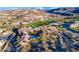 Stunning aerial of building exterior, with lush green landscaping, and ample parking space in a vibrant and scenic community at 387 Solitude Peak Ln, Henderson, NV 89012