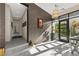This foyer features high ceilings, natural light, and a view into the landscaped front yard at 387 Solitude Peak Ln, Henderson, NV 89012