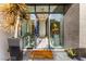 Elegant home foyer with high ceilings, modern chandelier, and artistic decor, creating a sophisticated entrance at 387 Solitude Peak Ln, Henderson, NV 89012