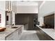 Modern kitchen with a long center island, sleek cabinetry, and stainless steel appliances at 387 Solitude Peak Ln, Henderson, NV 89012