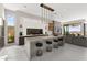 Modern kitchen with a large island, bar seating, and sleek appliances, perfect for cooking and entertaining guests at 387 Solitude Peak Ln, Henderson, NV 89012