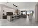 Open-concept kitchen features an island with stool seating and modern lighting at 387 Solitude Peak Ln, Henderson, NV 89012