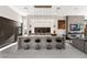 Modern kitchen with a large island, sleek black stools, and a living room view at 387 Solitude Peak Ln, Henderson, NV 89012
