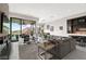 Open-concept living area with a modern fireplace and outdoor access at 387 Solitude Peak Ln, Henderson, NV 89012