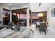 Open living space with sleek furnishings, fireplace and seamless indoor-outdoor living with a stunning view at 387 Solitude Peak Ln, Henderson, NV 89012