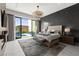 Modern main bedroom with a view of the pool, a grand chandelier, and elegant decor at 387 Solitude Peak Ln, Henderson, NV 89012