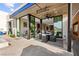 Stylish outdoor patio area featuring comfortable seating and seamless indoor-outdoor living at 387 Solitude Peak Ln, Henderson, NV 89012