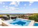 Inviting pool area with stunning views, comfortable seating, and modern design, perfect for relaxation at 387 Solitude Peak Ln, Henderson, NV 89012