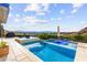 Stunning backyard pool area with ample lounging space and scenic views, perfect for entertaining at 387 Solitude Peak Ln, Henderson, NV 89012