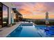 Inviting pool area with a spa, lounge chairs, and an outdoor dining area, with a view at 387 Solitude Peak Ln, Henderson, NV 89012
