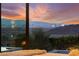 Breathtaking view of city skyline and landscape from bedroom with cozy bedding at 387 Solitude Peak Ln, Henderson, NV 89012