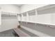 This walk-in closet features custom shelving, built-in rods, and spacious floorplan at 387 Solitude Peak Ln, Henderson, NV 89012