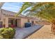 Charming backyard patio area offers space for outdoor relaxation and entertaining amid desert landscaping at 4043 Lilac Creek Ct, Las Vegas, NV 89122