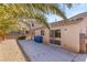 Inviting backyard featuring a concrete patio and desert landscape, perfect for outdoor enjoyment and privacy at 4043 Lilac Creek Ct, Las Vegas, NV 89122
