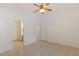 Spacious room with an ensuite bathroom featuring tiled floor and ceiling fan at 4043 Lilac Creek Ct, Las Vegas, NV 89122
