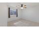 Bedroom featuring neutral walls, tile floors, a ceiling fan, and a bright window with curtains at 4043 Lilac Creek Ct, Las Vegas, NV 89122