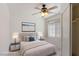Bedroom featuring neutral walls, tile floors, a ceiling fan, a bright window, and a closet at 4043 Lilac Creek Ct, Las Vegas, NV 89122