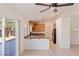 Bright kitchen with granite countertops, stainless steel appliances, and a sliding glass door to the backyard at 4043 Lilac Creek Ct, Las Vegas, NV 89122