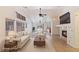 Bright living room with vaulted ceiling, fireplace, and tiled floors provides an airy open space at 4043 Lilac Creek Ct, Las Vegas, NV 89122
