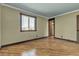Neutral bedroom with warm wood floors, large window, and ample space at 4272 Sheppard Dr, Las Vegas, NV 89121