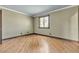 Corner bedroom showcasing light paint, warm wood floors, and natural light at 4272 Sheppard Dr, Las Vegas, NV 89121