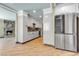 Kitchen with stainless steel appliances and view of a stone fireplace in the living room at 4272 Sheppard Dr, Las Vegas, NV 89121
