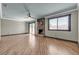 Large living room with a stone fireplace, large window, and sliding glass door at 4272 Sheppard Dr, Las Vegas, NV 89121