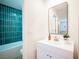 Charming bathroom features a stylish vanity with a modern sink and a view of the tub at 4600 University Center Dr # 72, Las Vegas, NV 89119