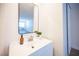 This bright vanity includes a modern mirror, sleek fixtures and wood-style flooring at 4600 University Center Dr # 72, Las Vegas, NV 89119