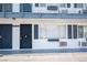 Clean and well-maintained building exterior featuring blue doors, shutters and accents at 4600 University Center Dr # 72, Las Vegas, NV 89119