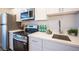 The kitchen is equipped with stainless steel appliances and has quartz countertops at 4600 University Center Dr # 72, Las Vegas, NV 89119
