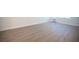A view of the light-colored wood-look floors in the light and bright living room at 4600 University Center Dr # 72, Las Vegas, NV 89119