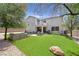 Large backyard with artificial turf, a patio, and mature trees offering great outdoor living at 50 Desert Castle Ct, Henderson, NV 89012