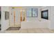 Bright bathroom featuring a soaking tub, separate shower, and tiled surround at 50 Desert Castle Ct, Henderson, NV 89012