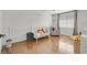 Cozy Bedroom with hardwood floors, crib, chair, and natural light at 50 Desert Castle Ct, Henderson, NV 89012