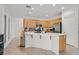 Modern kitchen featuring an island, stainless steel appliances, and tiled flooring at 50 Desert Castle Ct, Henderson, NV 89012