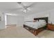Spacious main bedroom with neutral carpeting, walk-in closet, and abundant natural light at 50 Desert Castle Ct, Henderson, NV 89012