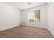 Neutral bedroom featuring carpet, a window, and a closet at 5049 Running Rapids Ave, Las Vegas, NV 89130