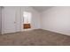 Bedroom featuring neutral carpet and an entryway into a bathroom at 5049 Running Rapids Ave, Las Vegas, NV 89130