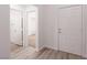 Bright entryway featuring wood-look flooring, white walls, and access to other rooms at 5049 Running Rapids Ave, Las Vegas, NV 89130
